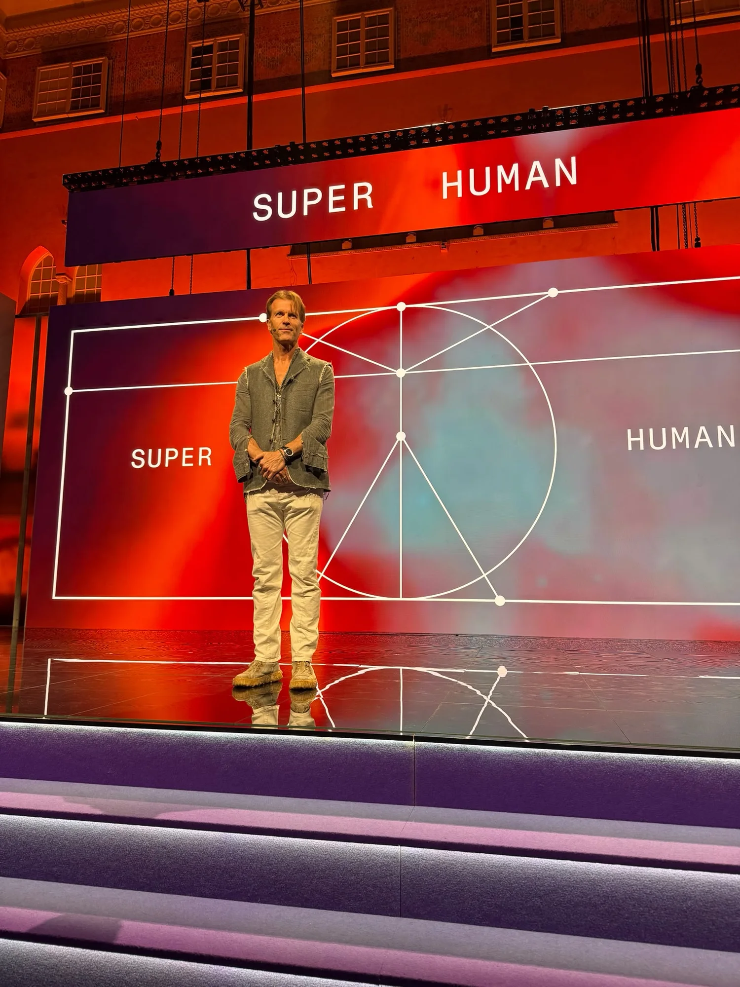 A speaker alone at centre stage on the Super Human set