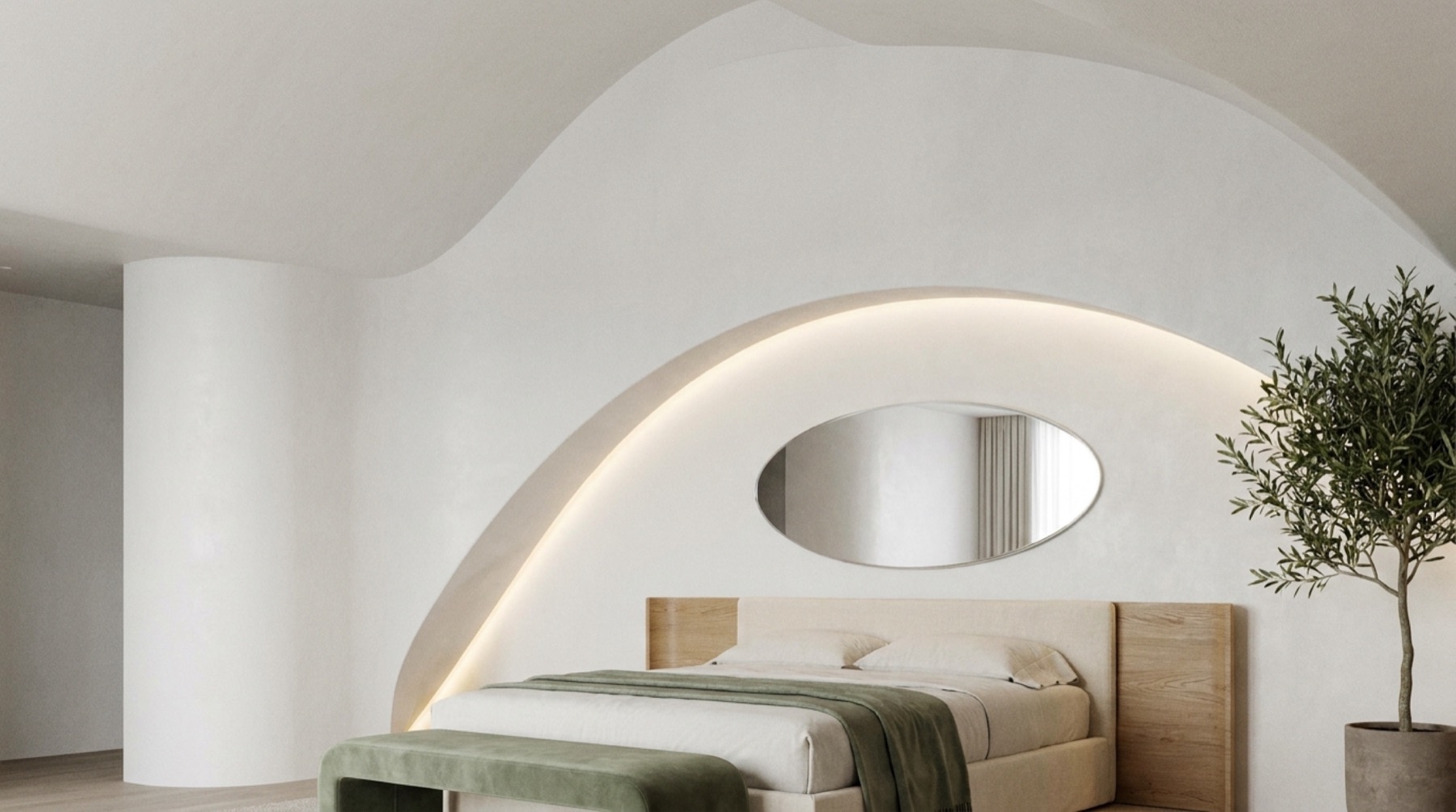 A bedroom under a sweeping curve of hand-shaped plaster, cove light tracing the arch, an olive tree beside the bed